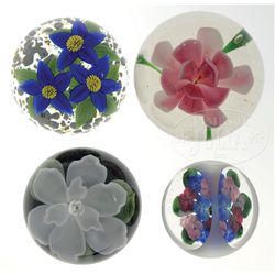 FOUR FLORAL PAPERWEIGHTS.