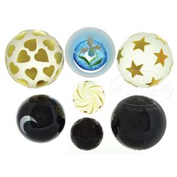 SEVEN CORREIA PAPERWEIGHTS.