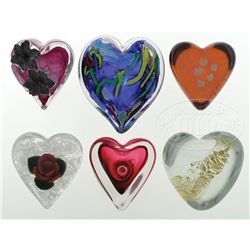 ELEVEN HEART SHAPED PAPERWEIGHTS.