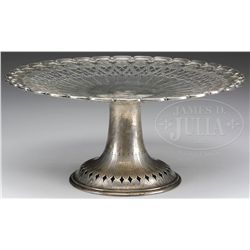 OUTSTANDING TIFFANY & CO. STERLING SILVER DECORATED RETICULATED CAKE STAND.