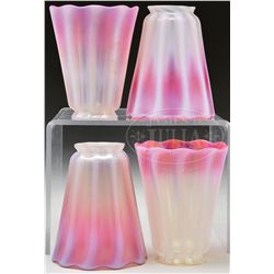 FOUR TIFFANY PASTEL ART GLASS SHADES.