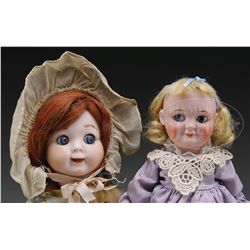 TWO GERMAN GOOGLY DOLLS.