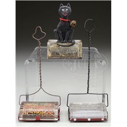 FOUR CANDY CONTAINERS.