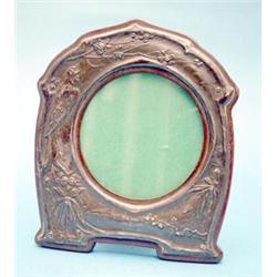 An Edwardian silver mounted photograph frame decorated with a nightingale and flowers, Birmingham...