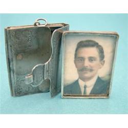 A Continental white metal miniature case containing a portrait of a gentleman £80-120...