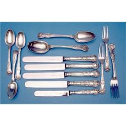 A William IV and later harlequin canteen of silver kings pattern flatware comprising:- 7 table fo...