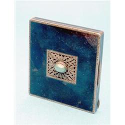 A Continental white metal compact, with black enamelled and marcasite set decoration £50-70...