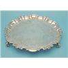 Image 1 : A William IV silver salver with piecrust scroll border, floral scroll engraving and scroll feet,...
