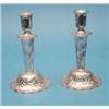 Image 1 : A pair of Swedish white metal candlesticks with floral decoration, 6ins. £80-120...