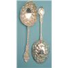 Image 1 : A pair of late Victorian silver dessert serving spoons with floral embossed bowls and scroll cast...