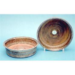 A pair of George III silver wine coasters with beaded rims and wooden bases, makers John Roberts...