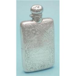 A late Victorian foliate engraved silver pocket flask with cup base £150-200...