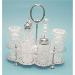 An Edwardian plated cruet stand fitted with 6 cut glass condiment bottles £250-300...