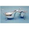 Image 1 : A pair of George V silver sauce boats with flying scroll handles and pad feet, Chester 1933 (14.5...
