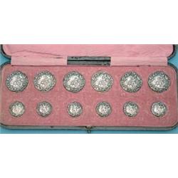 An Edwardian cased set of 12 silver buttons decorated with a lady and troubadour £200-250...
