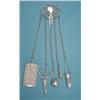 Image 1 : A late Victorian silver chatelaine fitted with notecase, scissors, tape measure, pencil and incom...