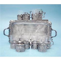 A late Victorian miniature silver tray, together with 10 assorted tot holders £150-200...