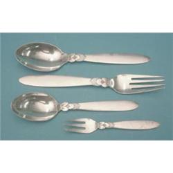 A set of 9 Georg Jensen sterling tableforks with stylised foliate stems, 7 matching dessert spoon...