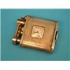Image 1 : A silver gilt watch movement set into the body of a petrol lever arm lighter £200-300...