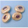 Image 1 : A pair of foliate engraved gold oval cufflinks set faceted oval garnets £150-250...