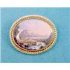 Image 1 : A Swiss polychrome enamelled oval brooch depicting a study of Interlaken, in rope twist frame £80...