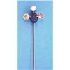Image 1 : A gold stick pin claw set with an oval cabochon sapphire and 3 old brilliant cut tinted diamonds...