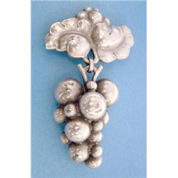 A Georg Jensen sterling silver leaf shaped brooch pattern No.217B supporting a drop in the form o...
