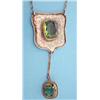 Image 1 : An Arts and Crafts design shield shaped hammered silver pendant necklace set with an oval faceted...