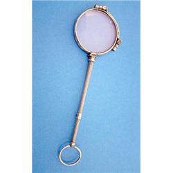 A gilt metal lorgnette with extending handle in original case and one other lorgnette £200-300...