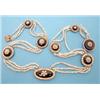 Image 1 : A Regency 3 row seed pearl necklace set at intervals with graduated circular gold, black enamel a...