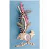 Image 1 : A white gold brooch designed as a bird of paradise perched on a branch, pave set round cut diamon...