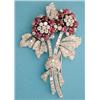 Image 1 : A French white gold floral spray dress clip pave set round and baguette cut diamonds and cabochon...