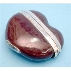 An Edwardian silver mounted nut vesta case £120-150...