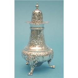 A George V silver caster with foliate scroll decoration, 6.5ins. £200-250...