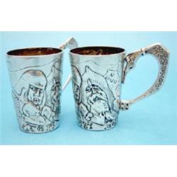 A pair of 84 Zlotnik cups decorated with warriors £120-150...