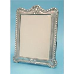 A George V silver mounted toilet mirror, 11ins. £120-180...