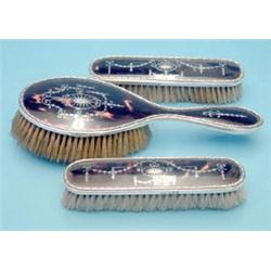 A set of 3 George V silver and tortoiseshell pique hair brushes £100-150...