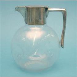 A late Victorian silver mounted dimpled glass claret jug £250-300...