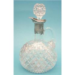An Edwardian silver mounted hobnail cut glass claret jug £500-700...