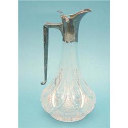 A Victorian silver mounted cut glass claret jug £350-400...
