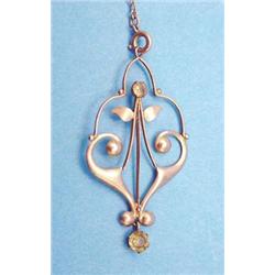 A 9ct gold Art Nouveau open work pendant set 2 round cut peridots £70-100...
