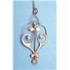 Image 1 : A 9ct gold Art Nouveau open work pendant set 2 round cut peridots £70-100...
