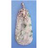Image 1 : A carved jade pendant on a diamond set 14k gold mount £200-300...