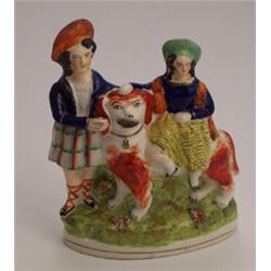 19th Century Staffordshire figure group - Young boy and girl with hound on an oval base, 7" high...