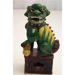 Pair of Chinese earthenware figures depicting yellow, brown and green glazed dogs of Fo, each wit...