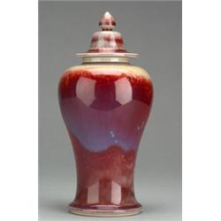Ruskin Chinese design baluster shaped vase with domed cover having high fired speckled red and bl...