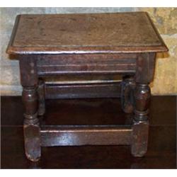Late 17th Century oak joint stool with moulded edge on turned supports united by stretchers, stam...
