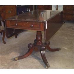 Regency mahogany Pembroke table fitted one real and one dummy drawer standing on a ring turned ta...