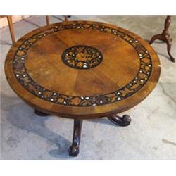 Victorian walnut circular snap top loo table having floral marquetry central medallion flanked by...