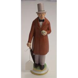 Royal Copenhagen porcelain figure depicting a gentleman dressed in a top hat and brown frock coat...